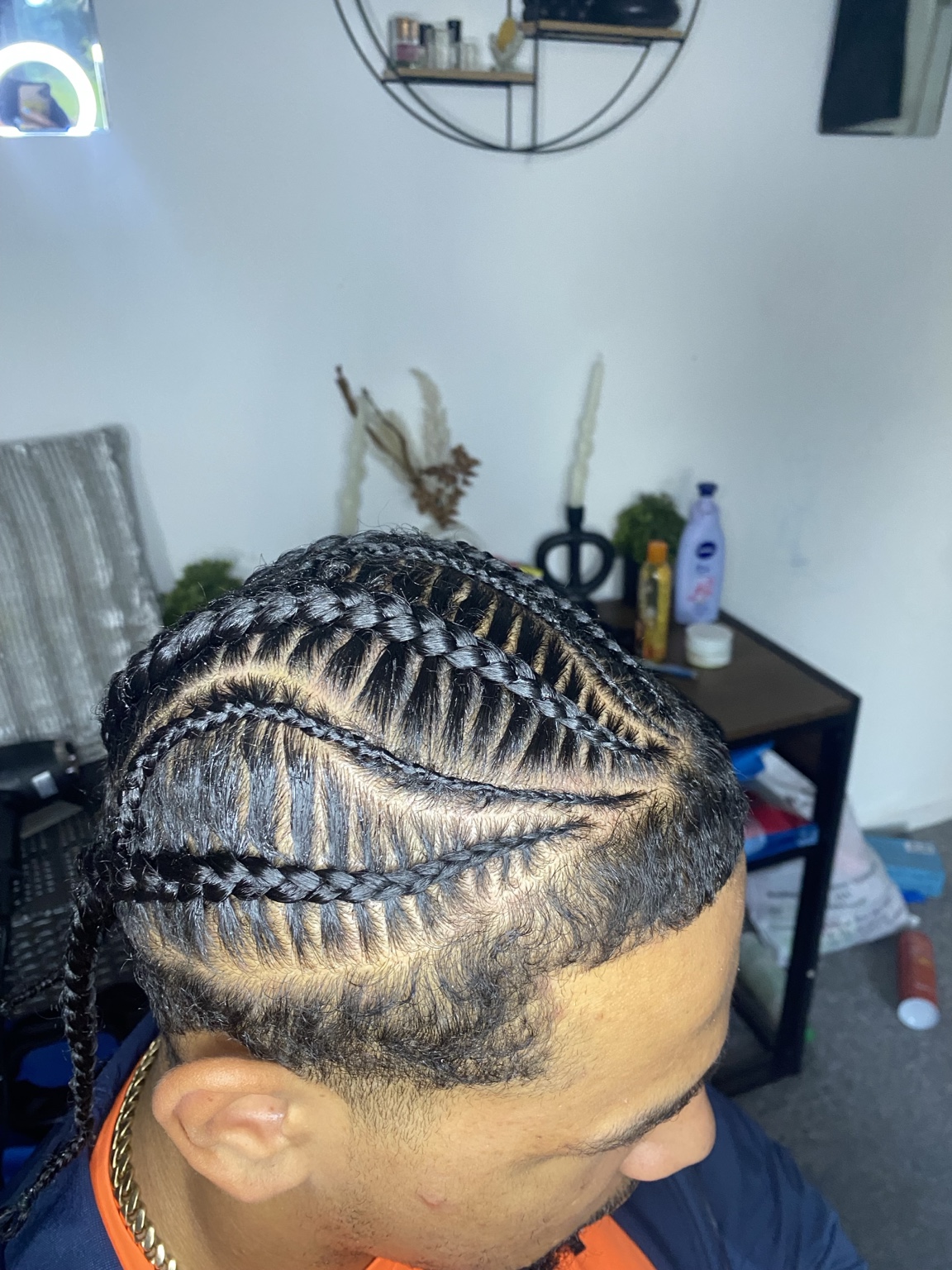 Side view of detailed cornrow braids